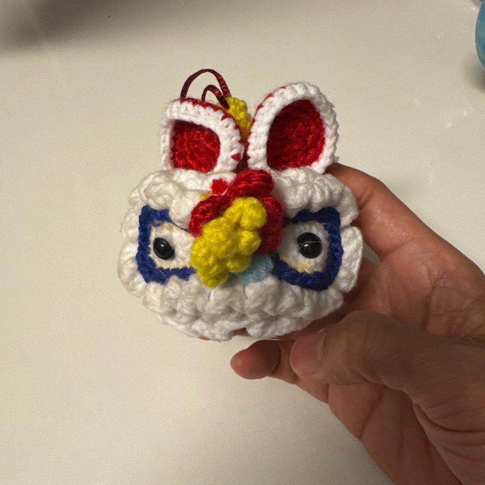 handmade crochet ornament inspired by the traditional Chinese Lion Dance costume